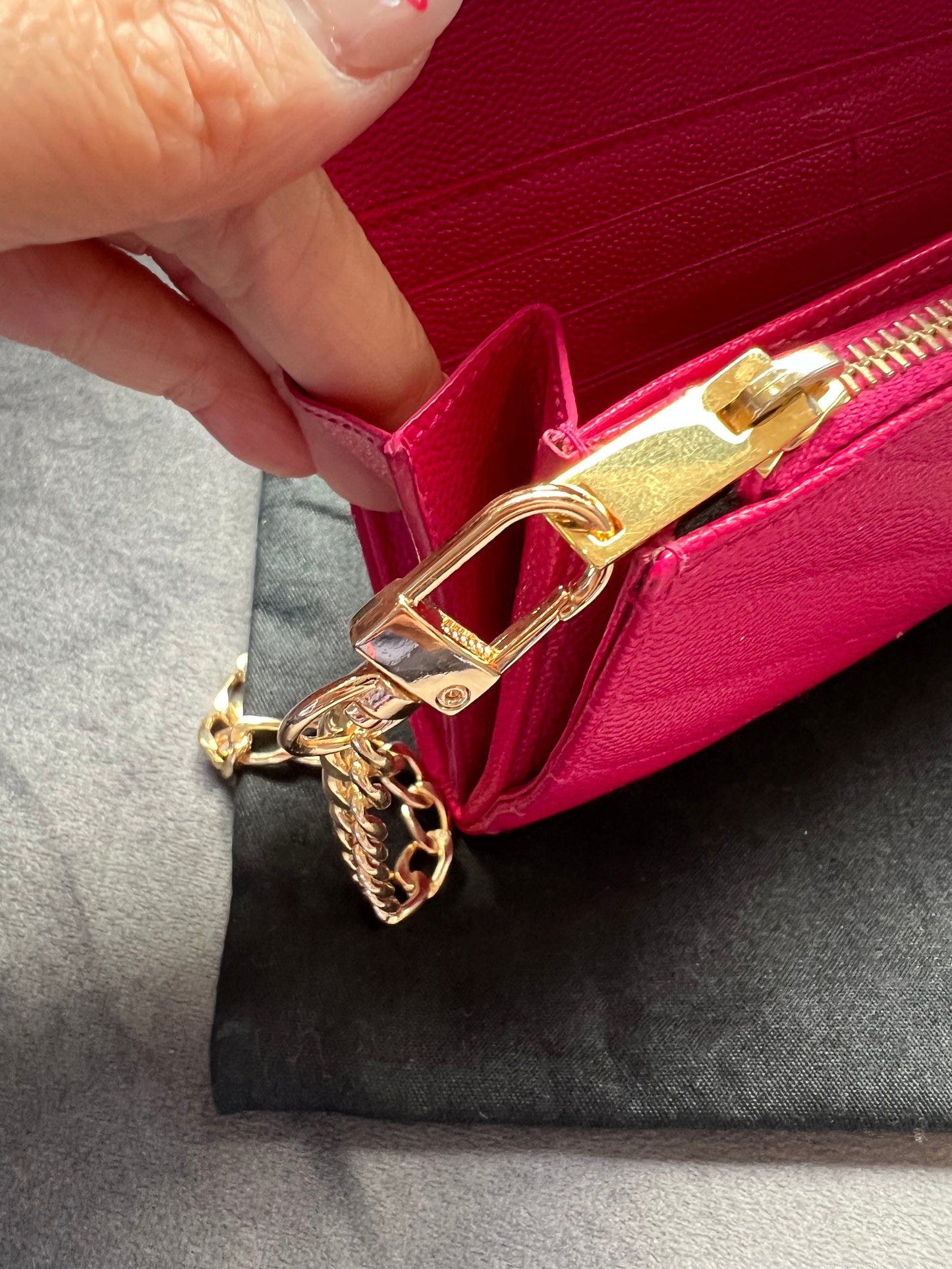 Pink Saint Laurent wallet on chain