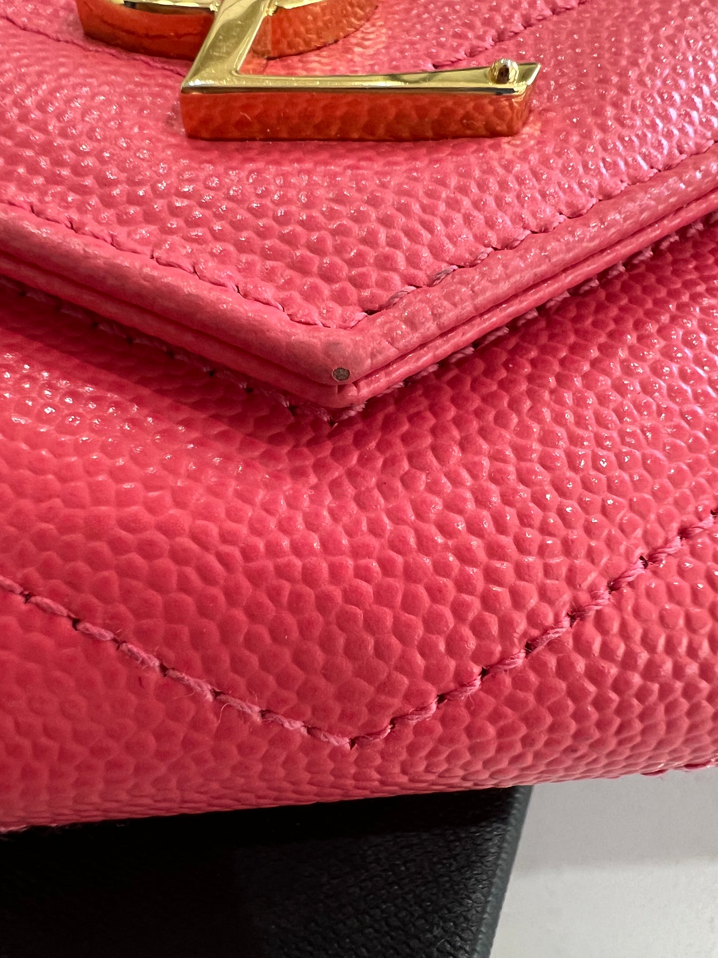 Pink YSL cassandre envelope wallet on chain