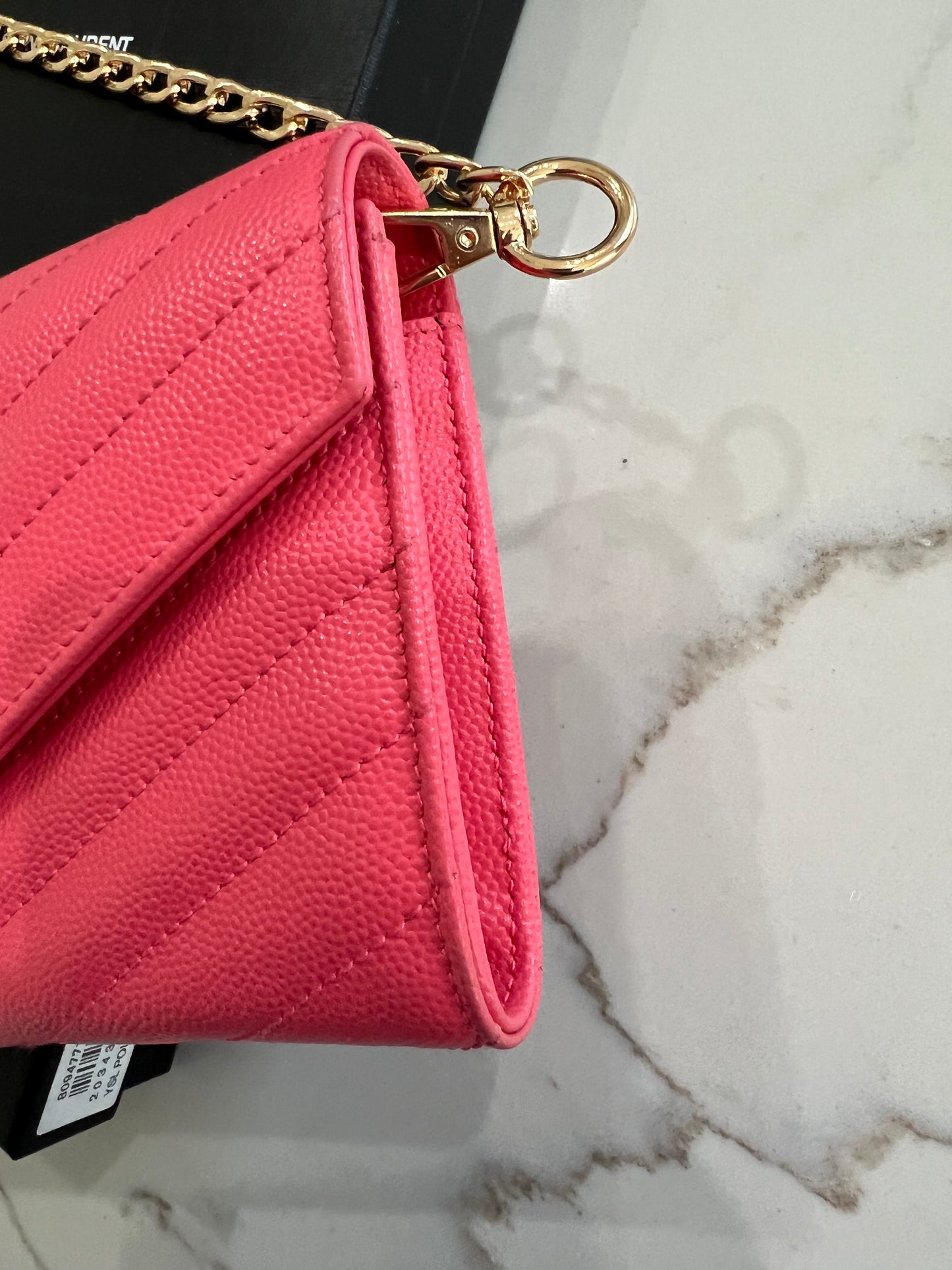 Pink YSL cassandre envelope wallet on chain
