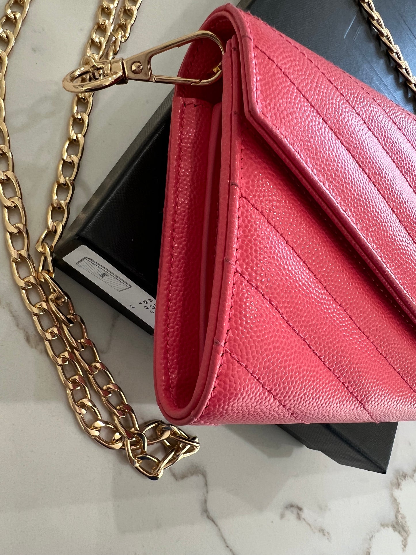 Pink YSL cassandre envelope wallet on chain