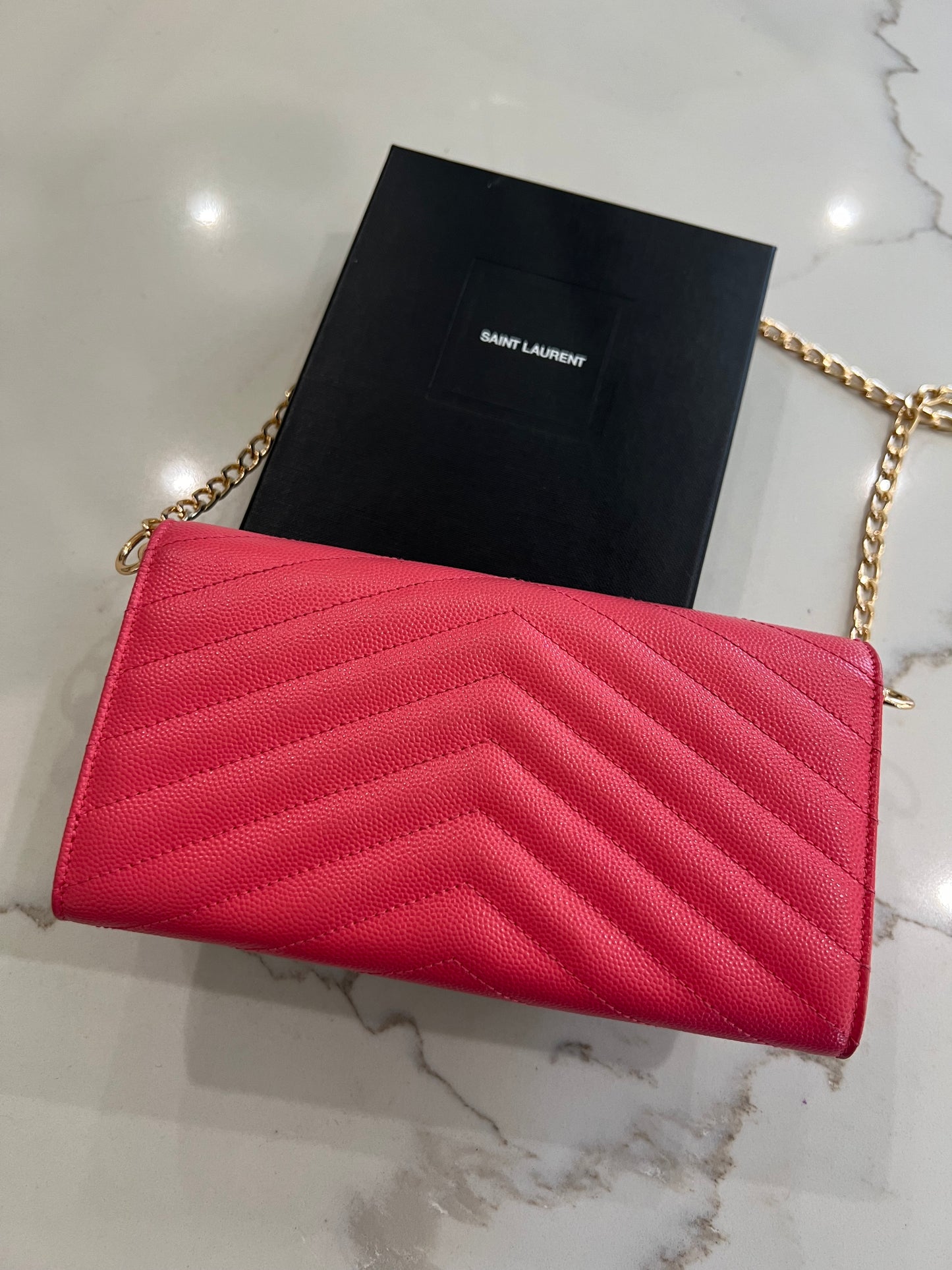 Pink YSL cassandre envelope wallet on chain