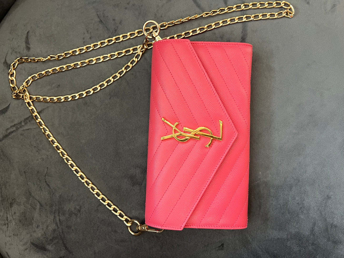 Pink YSL cassandre envelope wallet on chain