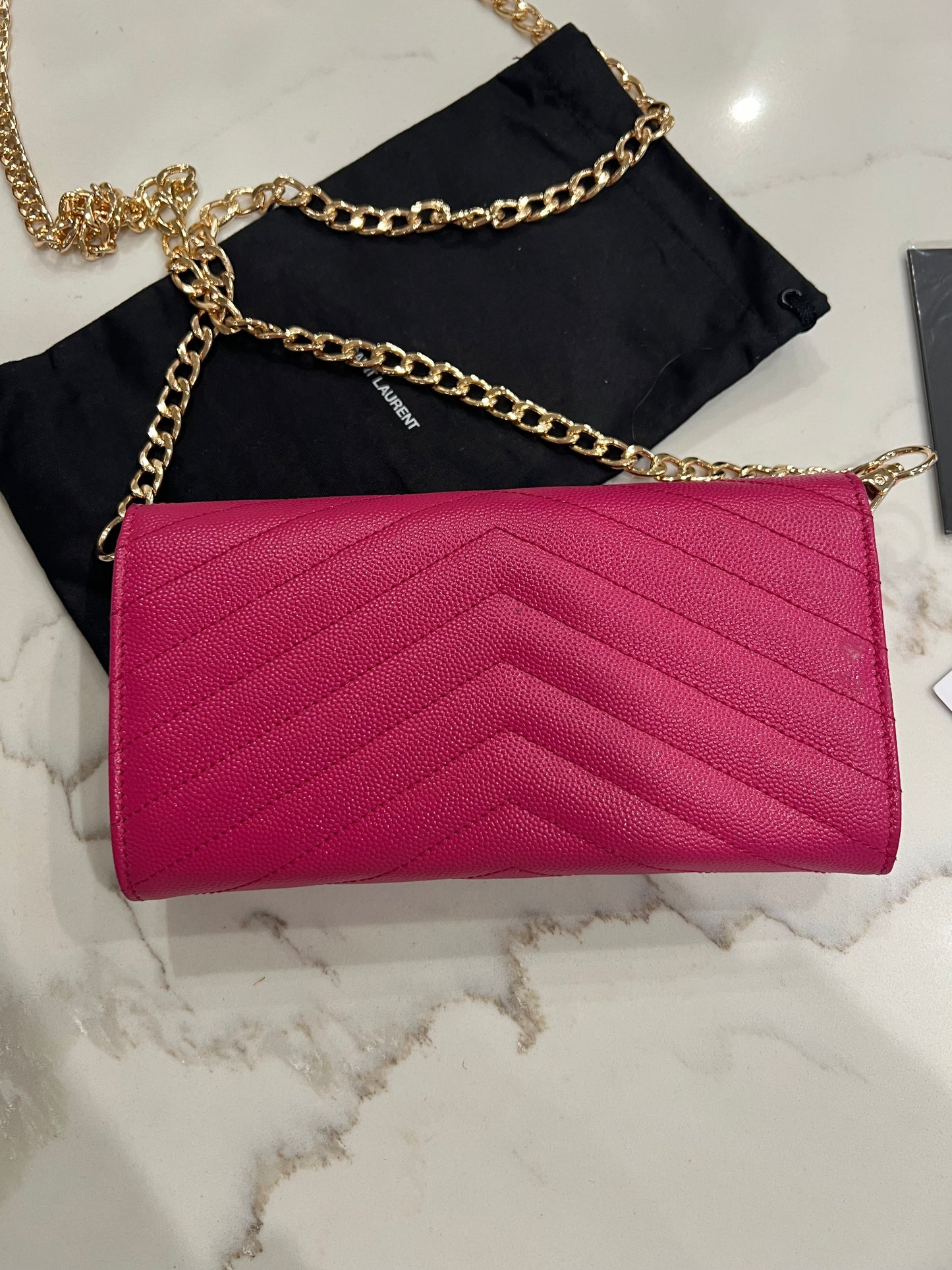 Pink YSL cassandre wallet on chain