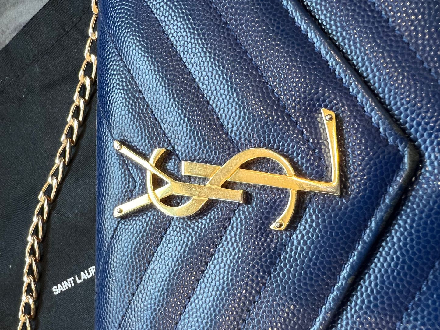 YSL monogram envelope flap wallet on chain