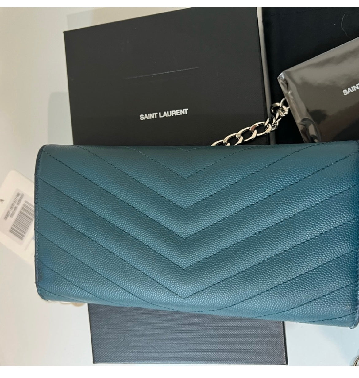 Turquoise YSL cassandre wallet on chain