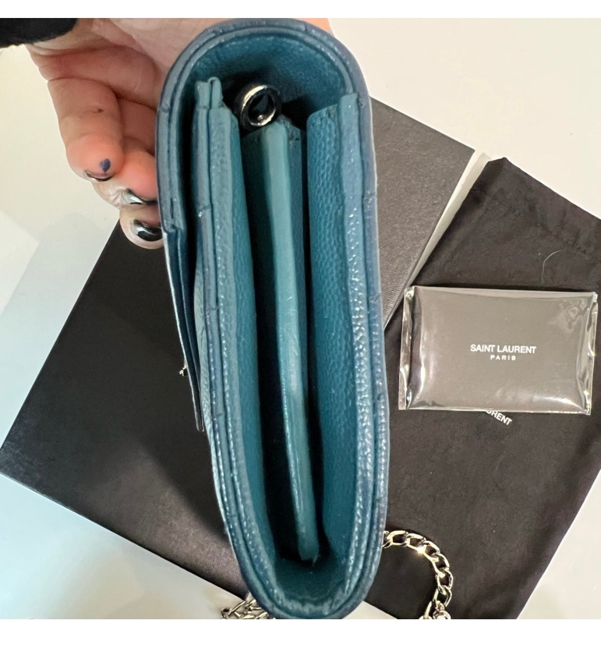 Turquoise YSL cassandre wallet on chain