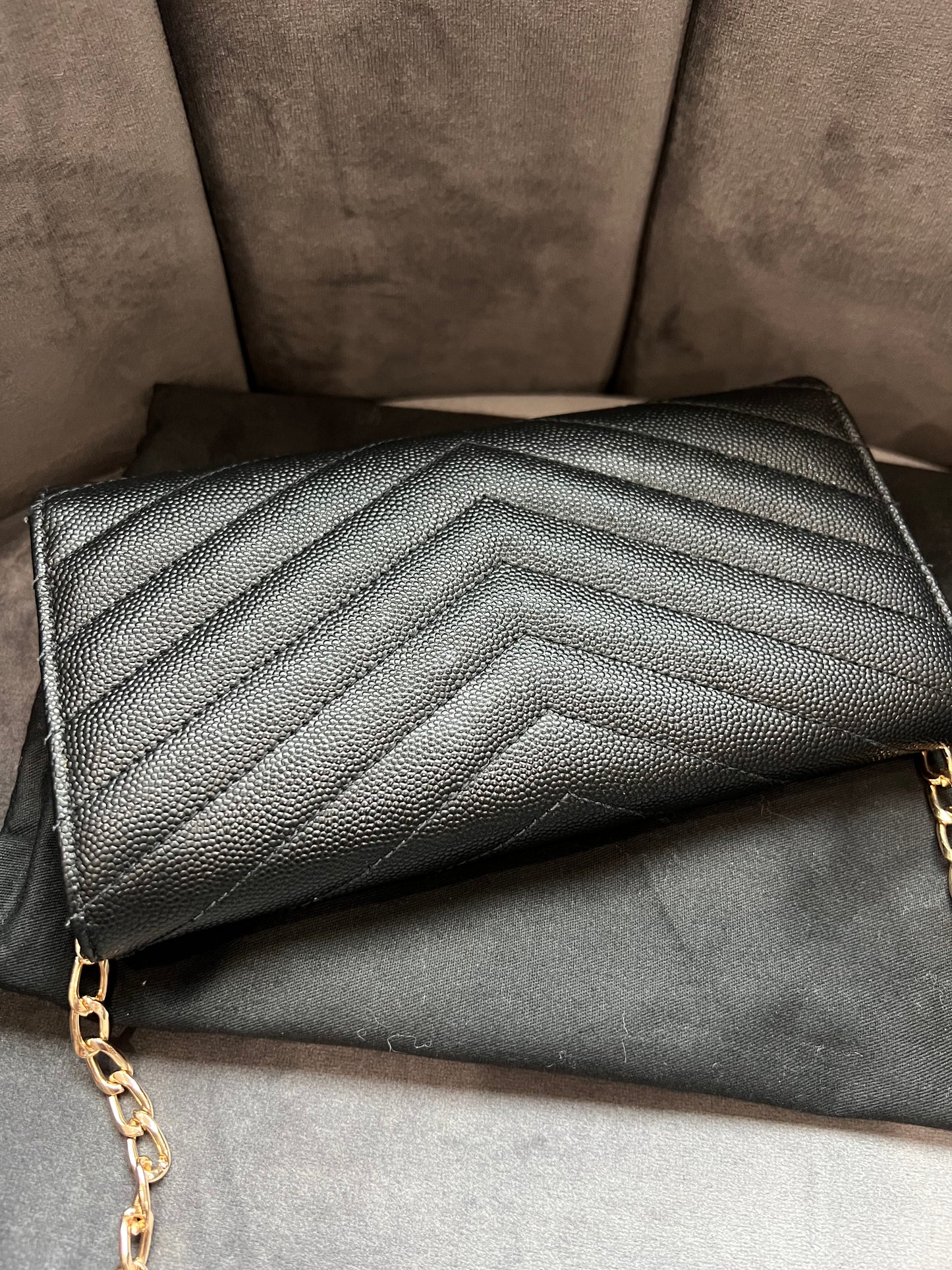 Black YSL cassandre envelope wallet on chain