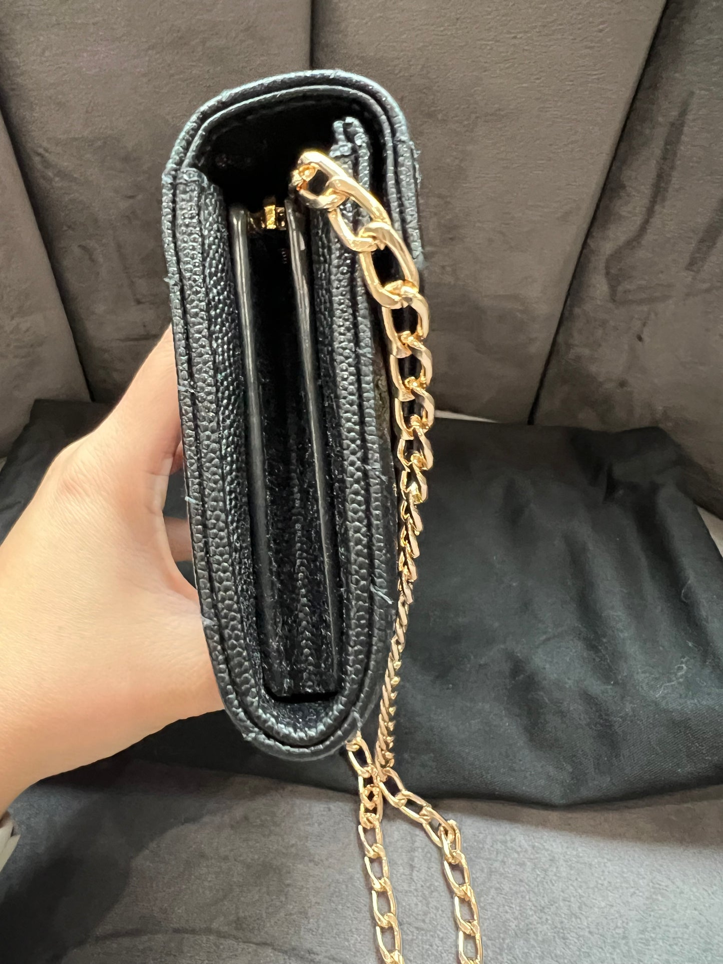 Black YSL cassandre envelope wallet on chain