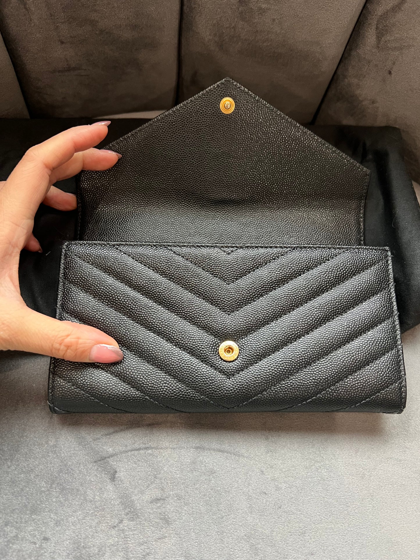 Black YSL cassandre envelope wallet on chain