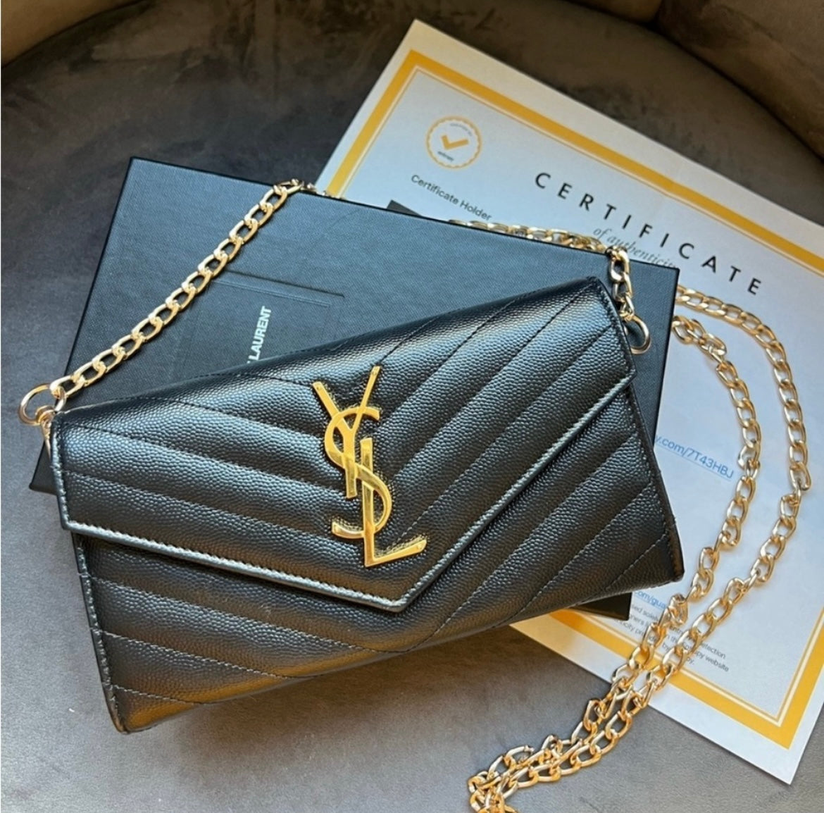 Black YSL cassandre envelope wallet on chain