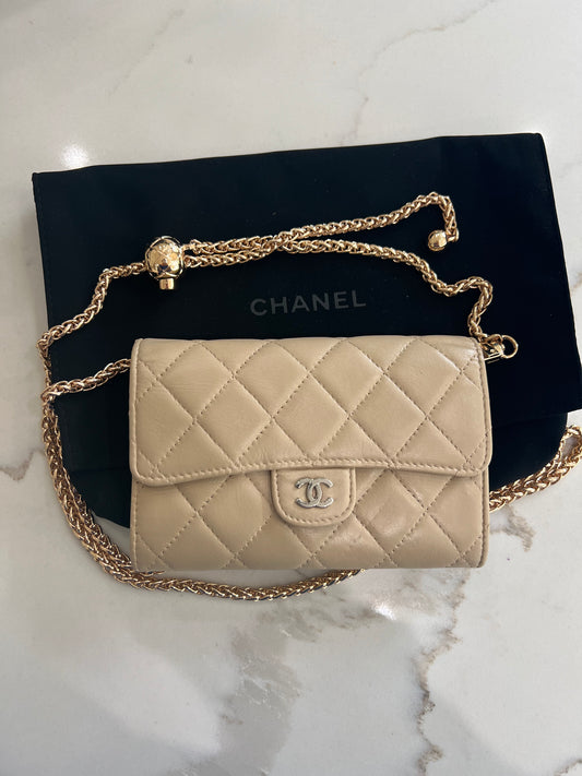 Beige gusseted Chanel timeless wallet on chain