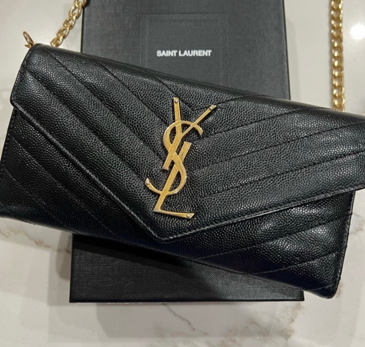 Black YSL cassandre envelope wallet on chain